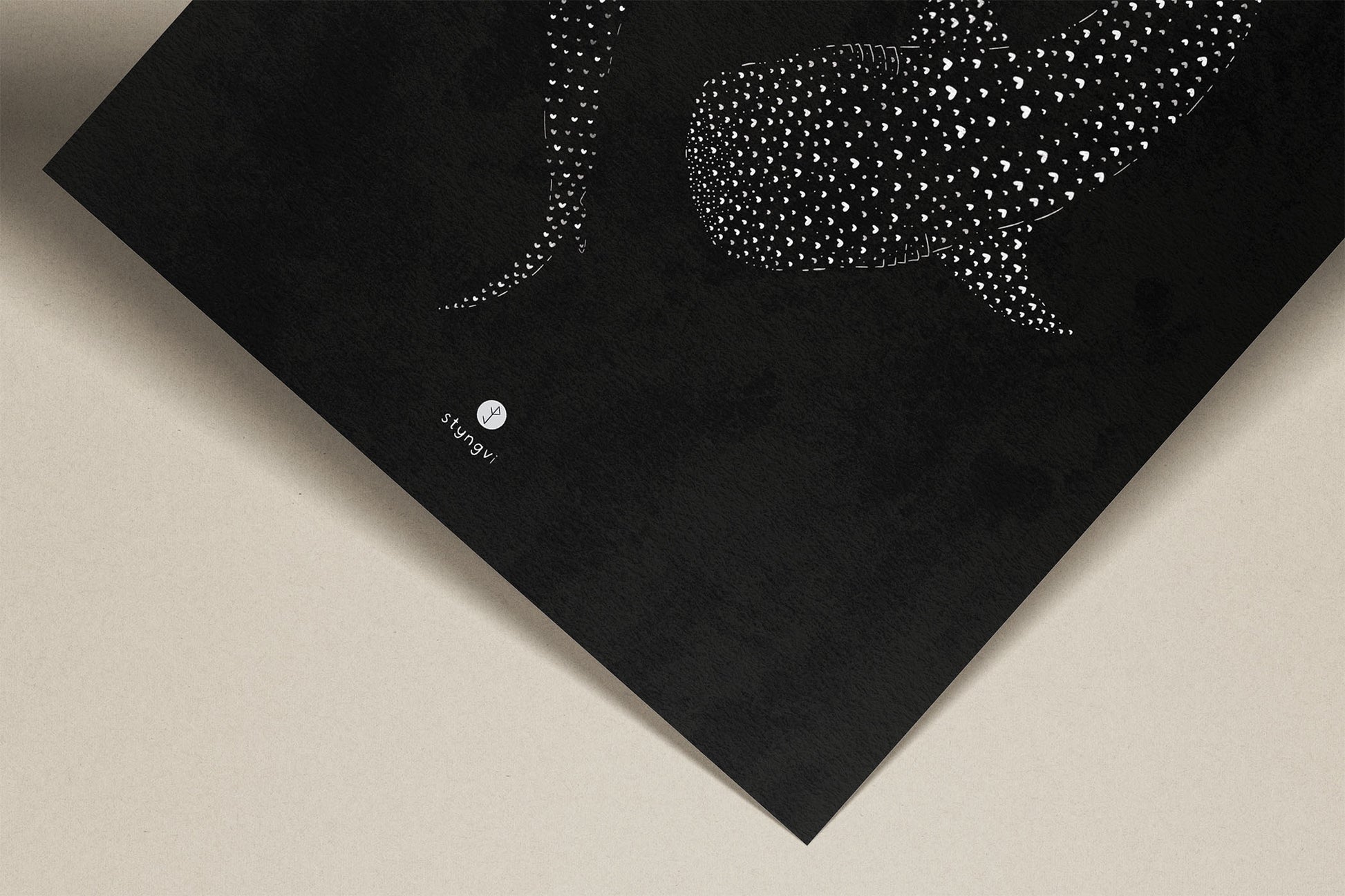 Close-up of the whale shark illustration showing fine linework and tiny heart details within the patterns on the bodies.