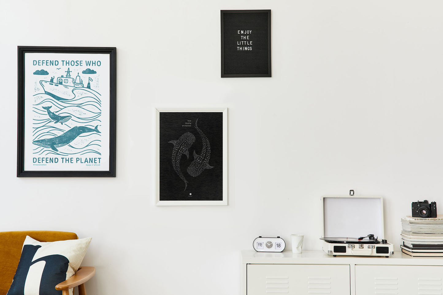 Framed whale shark art print displayed on a light-colored wall, styled in a minimal room setting.